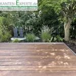 Edelstahl Rasenkante als Terrasseneinfassung im Garten